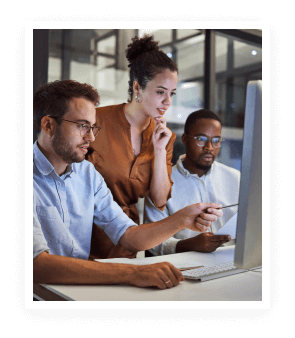 Professionals collaborating at a computer